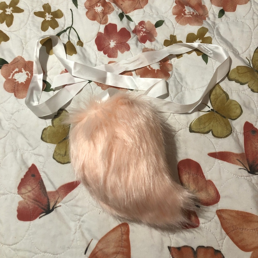 Pink fur tail with ribbon and pin attachment accessory